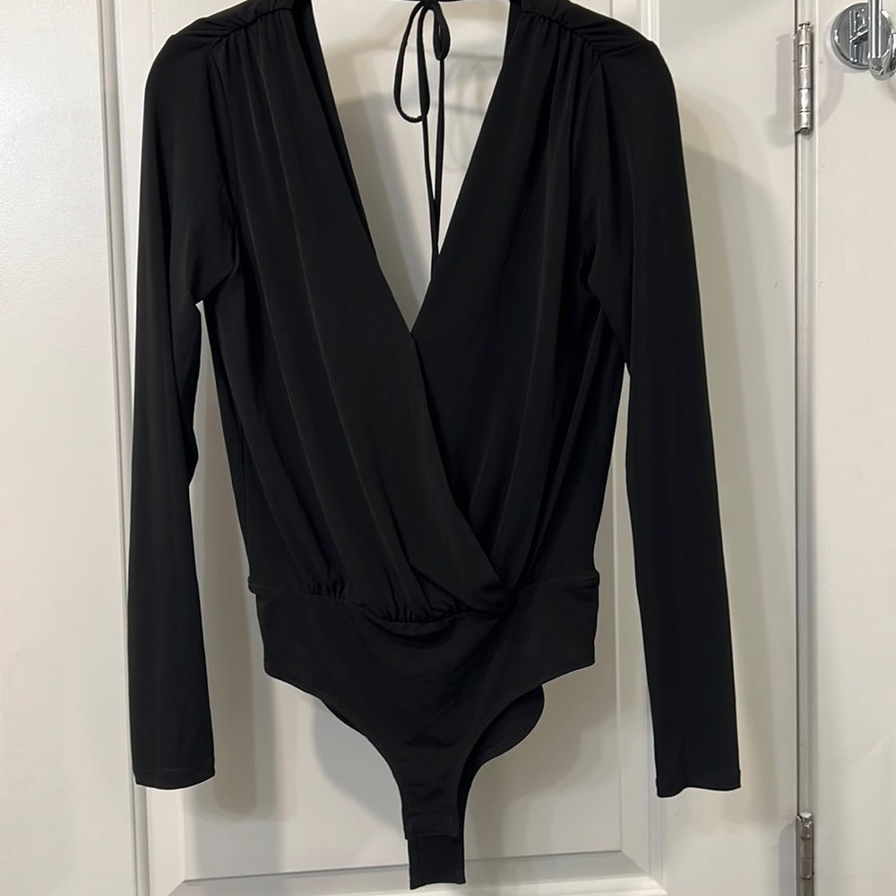 BCBG black bodysuit low cut back Snap buttons on bottom closure and chest area